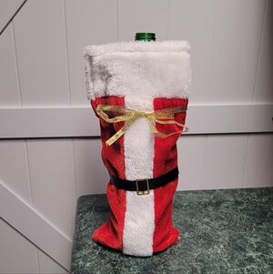 Festive Red and White Bottle Cover with Gold Bow and Black Belt
